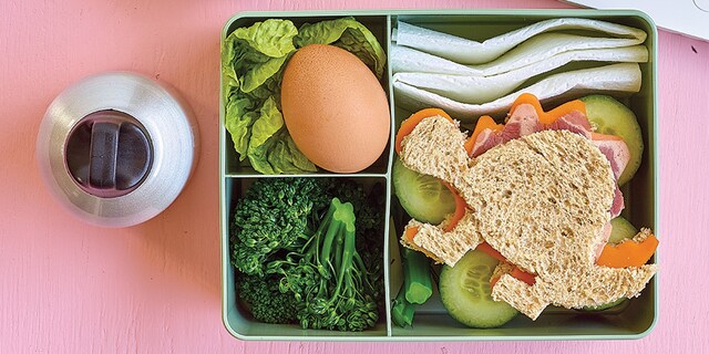 Boîte à bento avec des dino-tartines