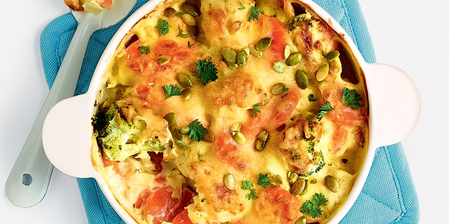 Groentegratin met kaas en pompoenpitten