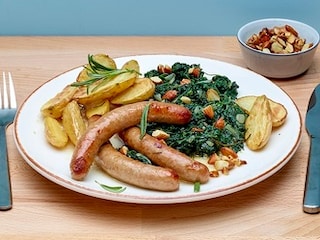 Chipolata met honing en spinazie met amandelen
