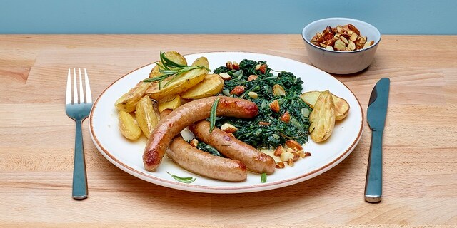 Chipolata met honing en spinazie met amandelen